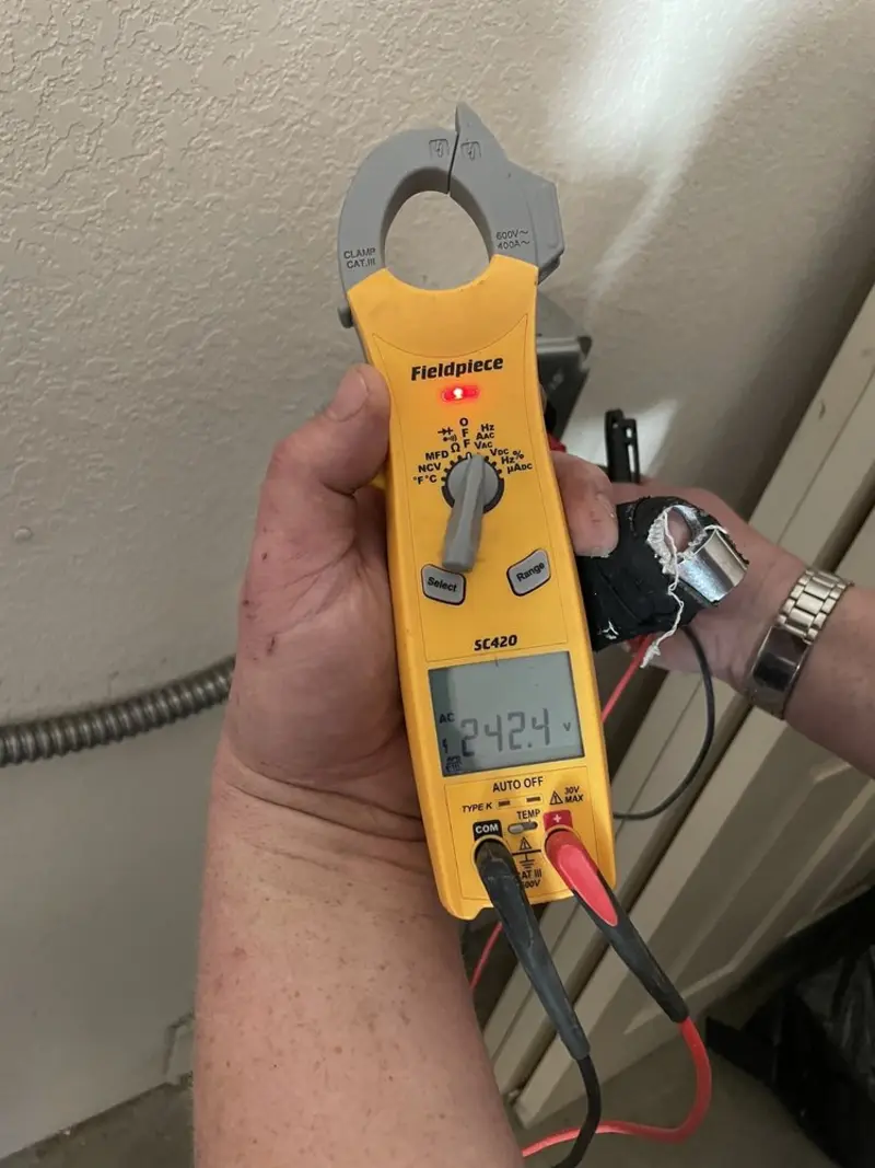 Voltage testing with clamp meter during Ceiling Fan Installation in Saks